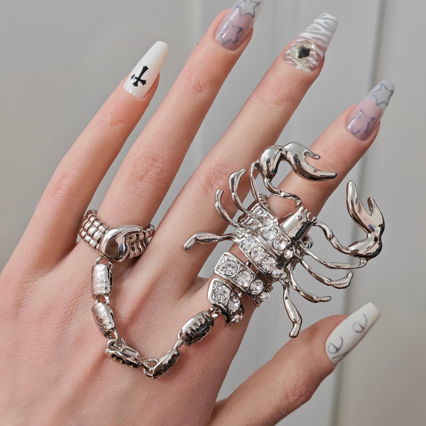 Scorpion Ring in open black velvet jewelry box, angled view