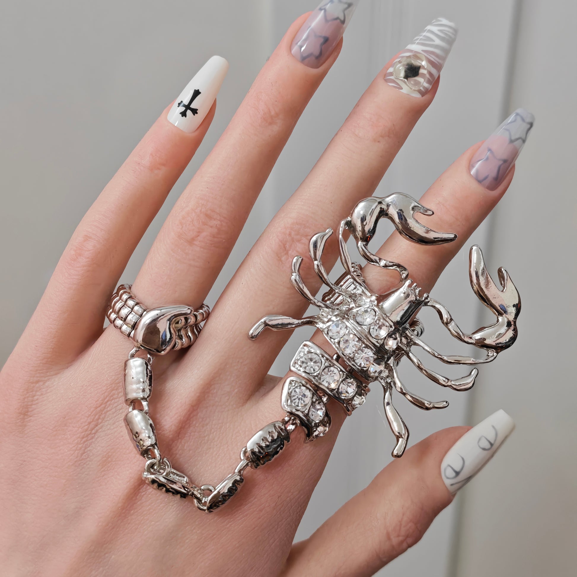 Scorpion Ring in open black velvet jewelry box, angled view