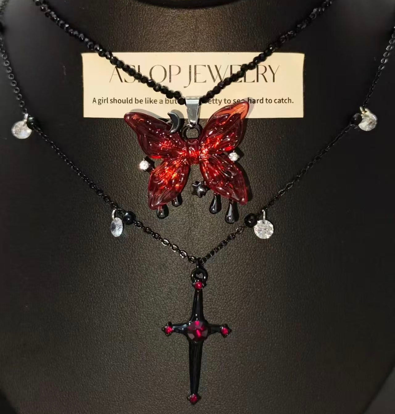 Blood Rose Butterfly & Gothic Cross Necklace on mannequin bust, front view close-up
