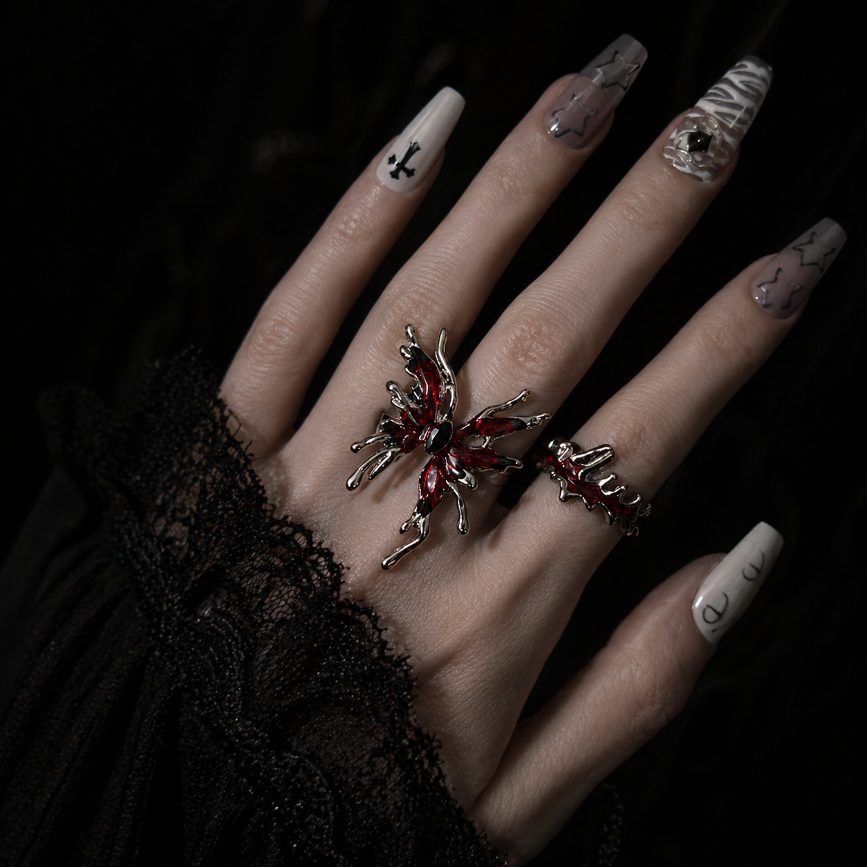 Red Butterfly Ring Set worn on finger, dark moody background – Aslop Treasure