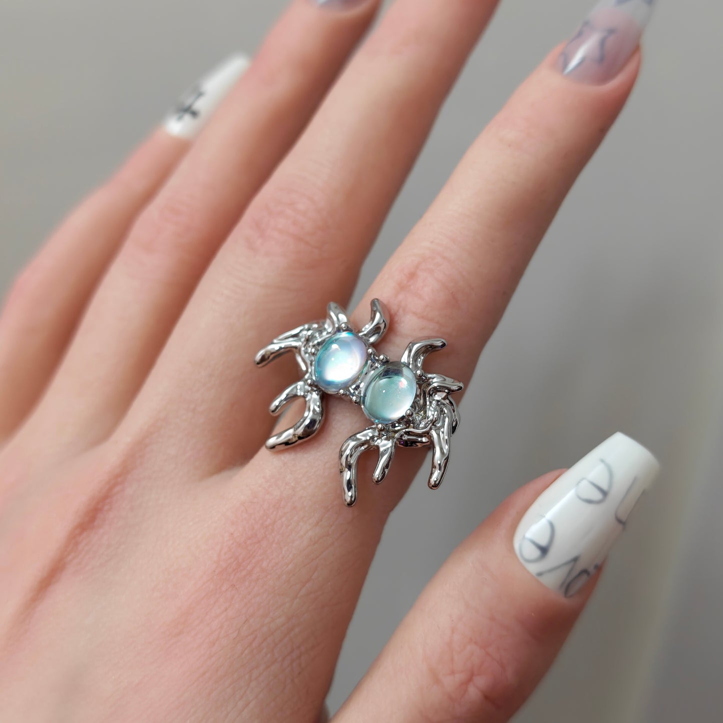 Monster Ring in open Aslop Jewelry white gift box, overhead flat view
