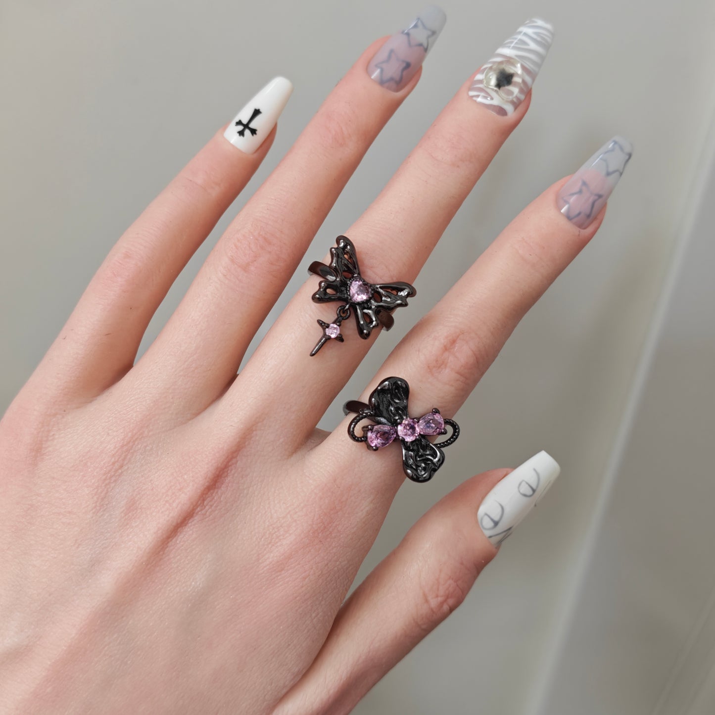 Pink Flutter Duo Adjustable Butterfly Heart & Crystal Stacking Rings in open Aslop Jewelry white gift box, overhead flat view