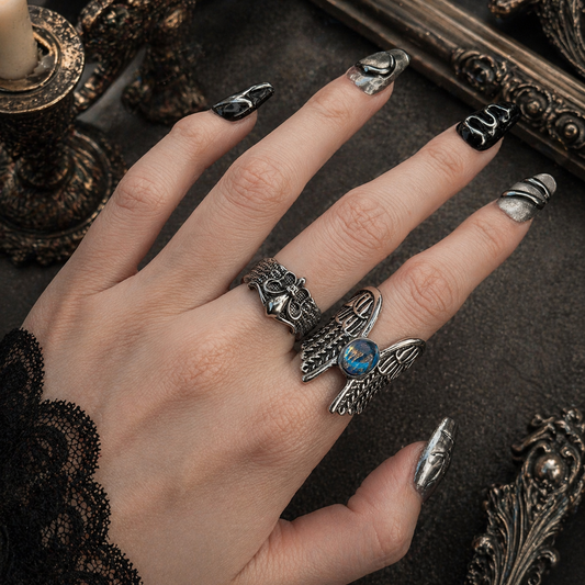 Guardian of the Dark Fallen Angel Wing Ring Set worn on finger, dark moody background – Aslop Treasure