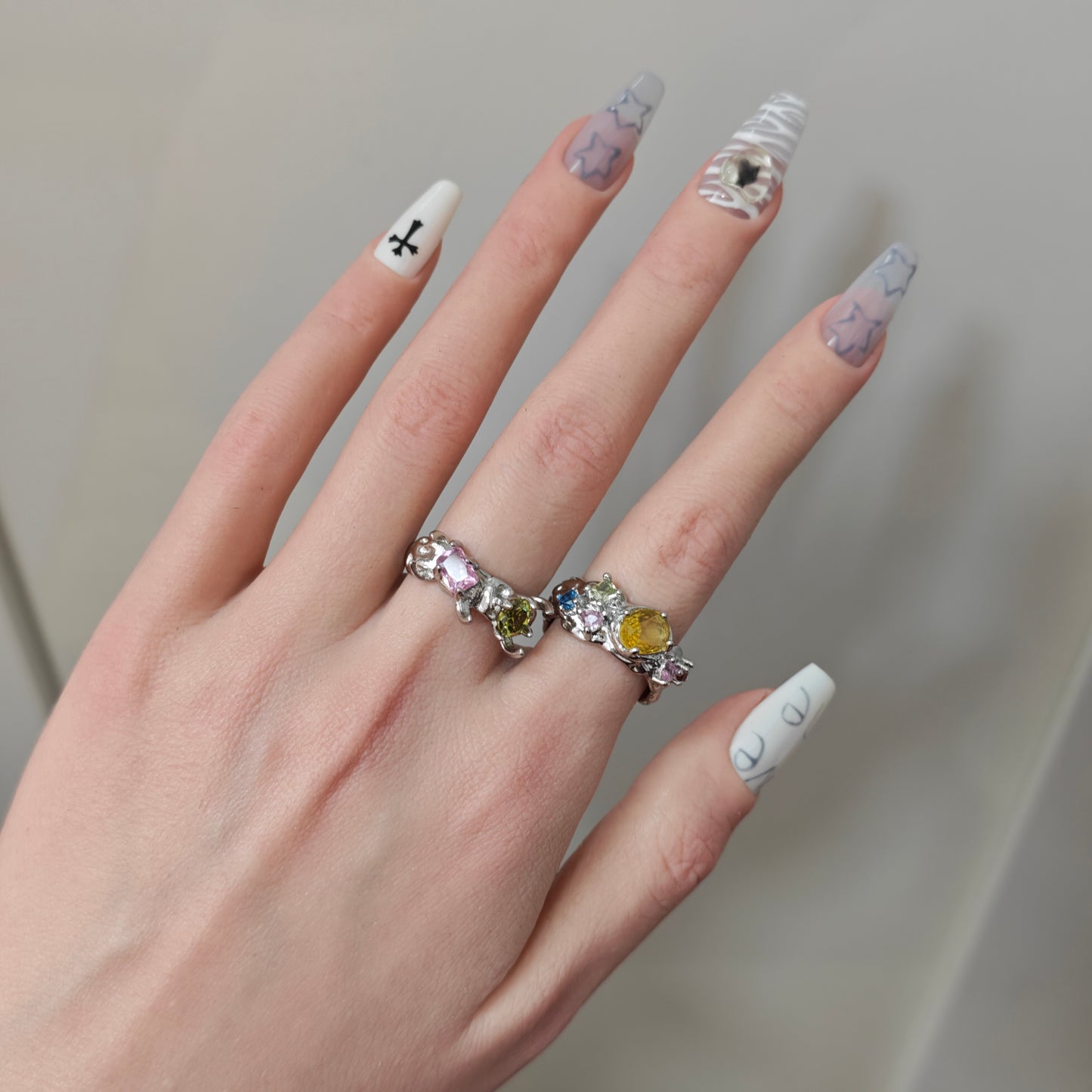 Colorful Zircon Claw Ring in open black velvet jewelry box, angled view