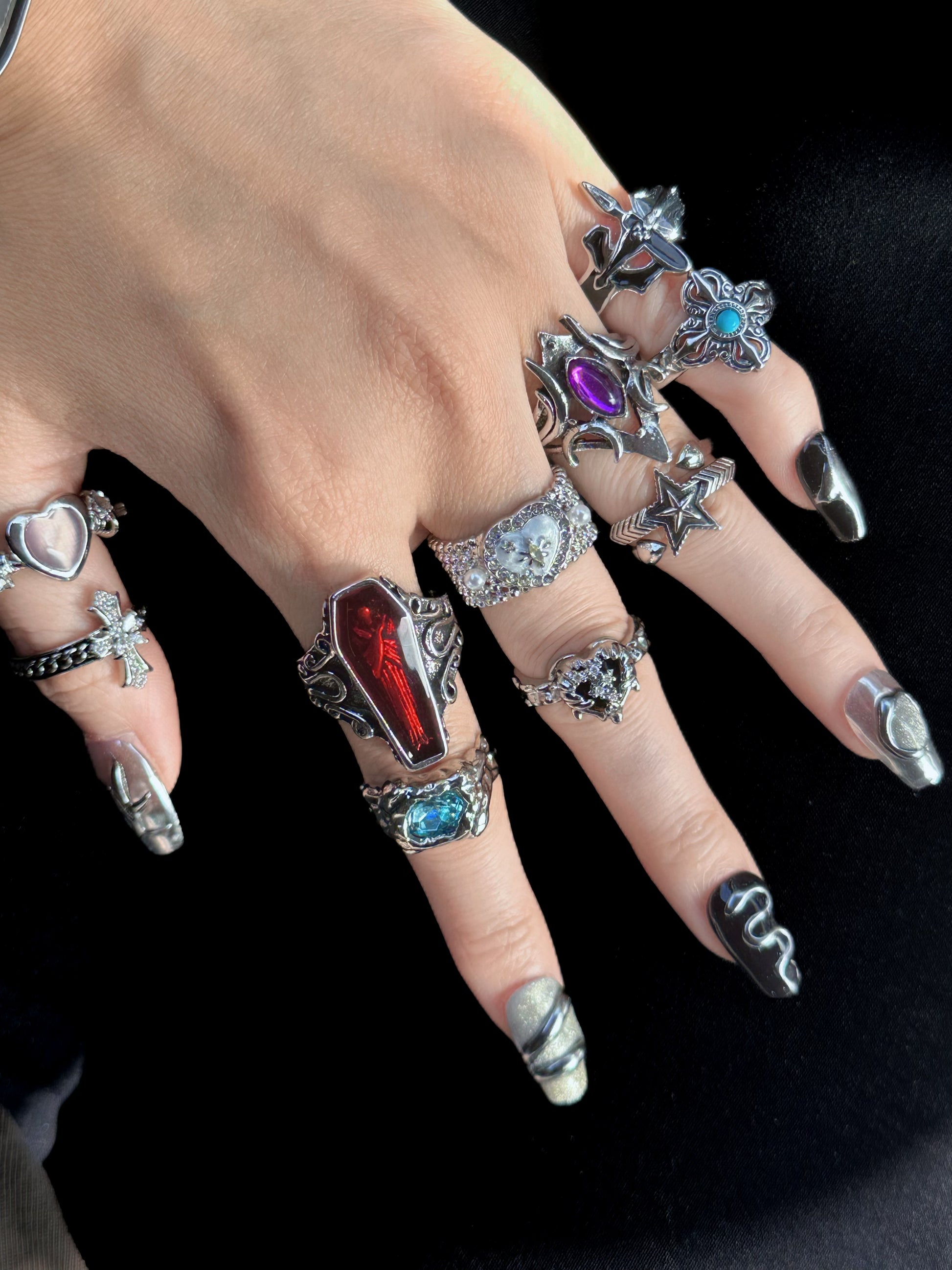 Gothic Romance Aesthetic Ring Collection on black mannequin hand, front view close-up