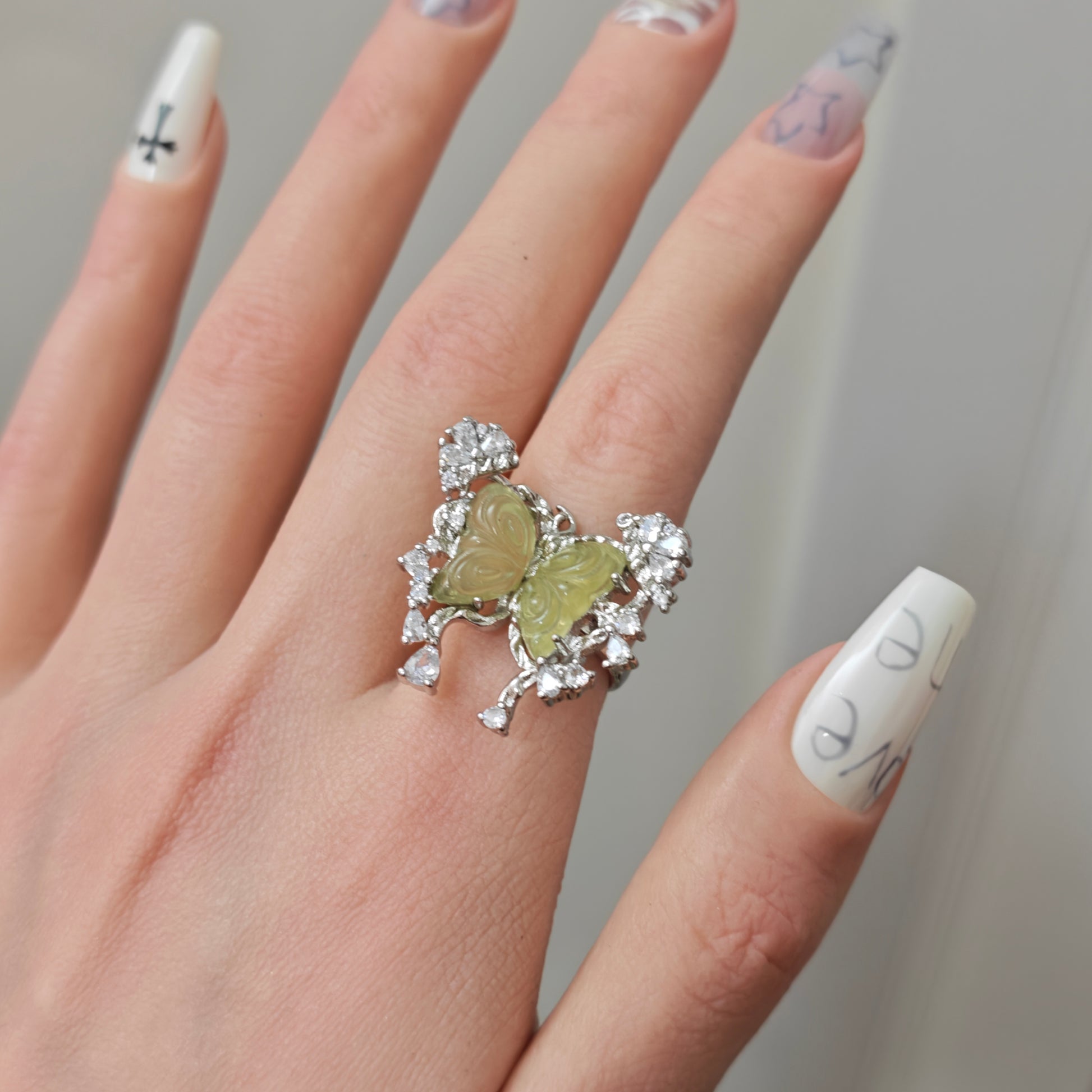 Green Carved Butterfly Ring in open Aslop Jewelry white gift box, angled view