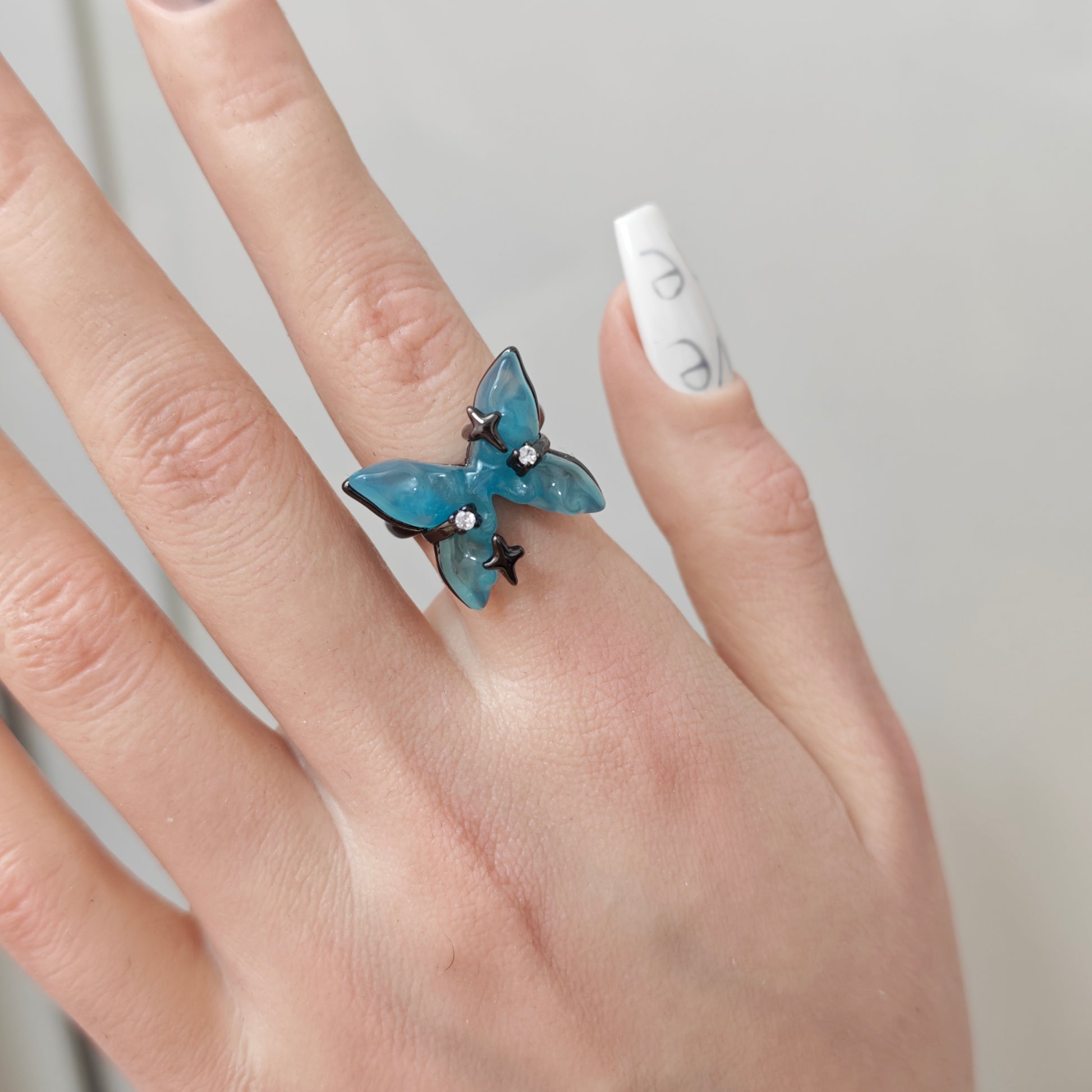 Blue Butterfly Resin Ring in open Aslop Jewelry white gift box, overhead flat view