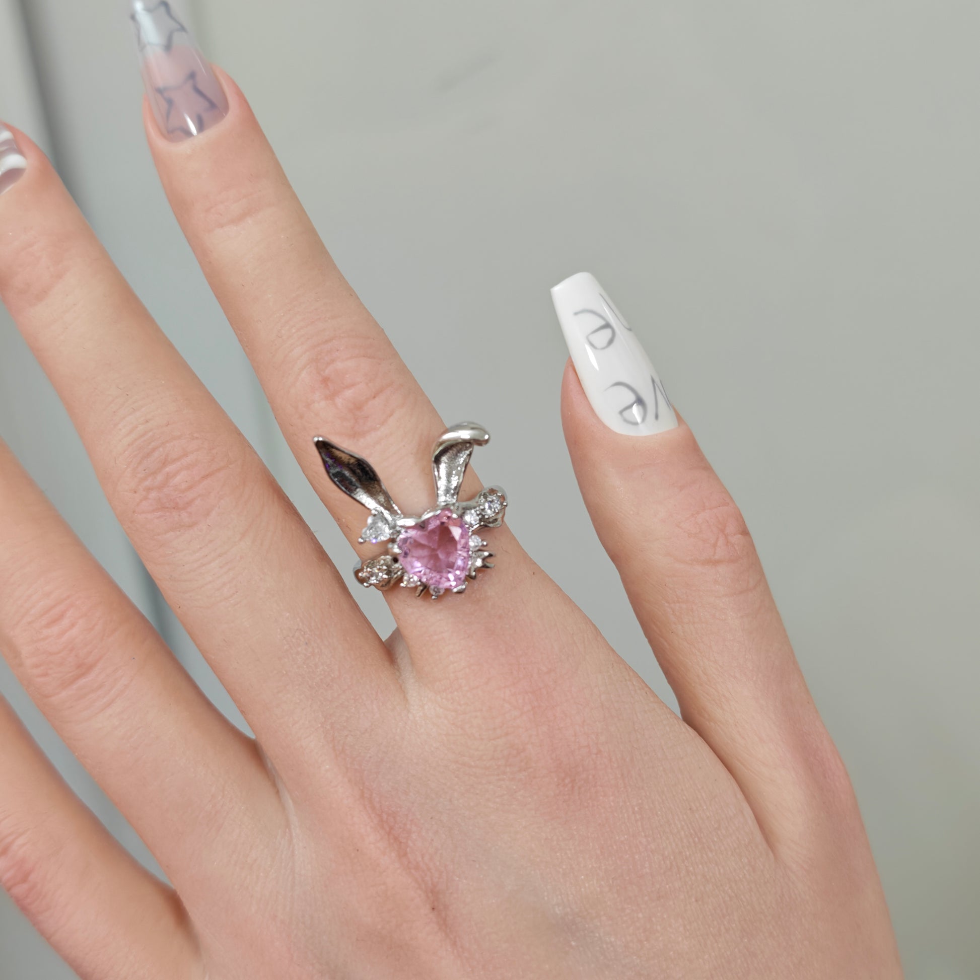 Pink Bunny Heart Ring in open black velvet jewelry box, overhead flat lay