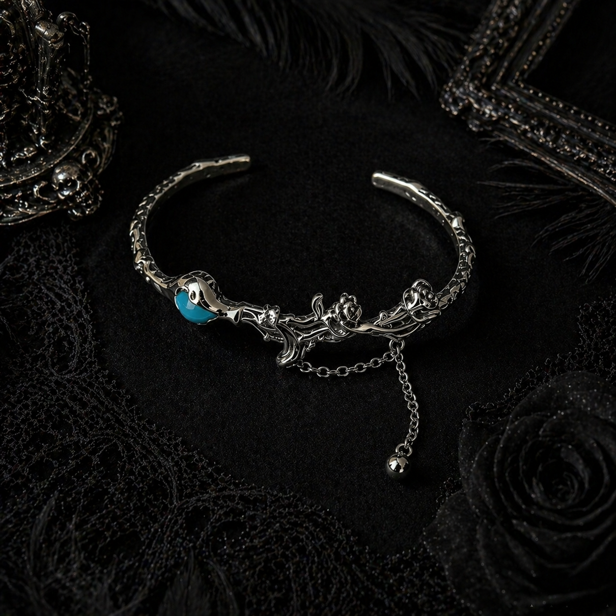 Silver rose thorn cuff bracelet with blue enamel centre, close-up detail view
