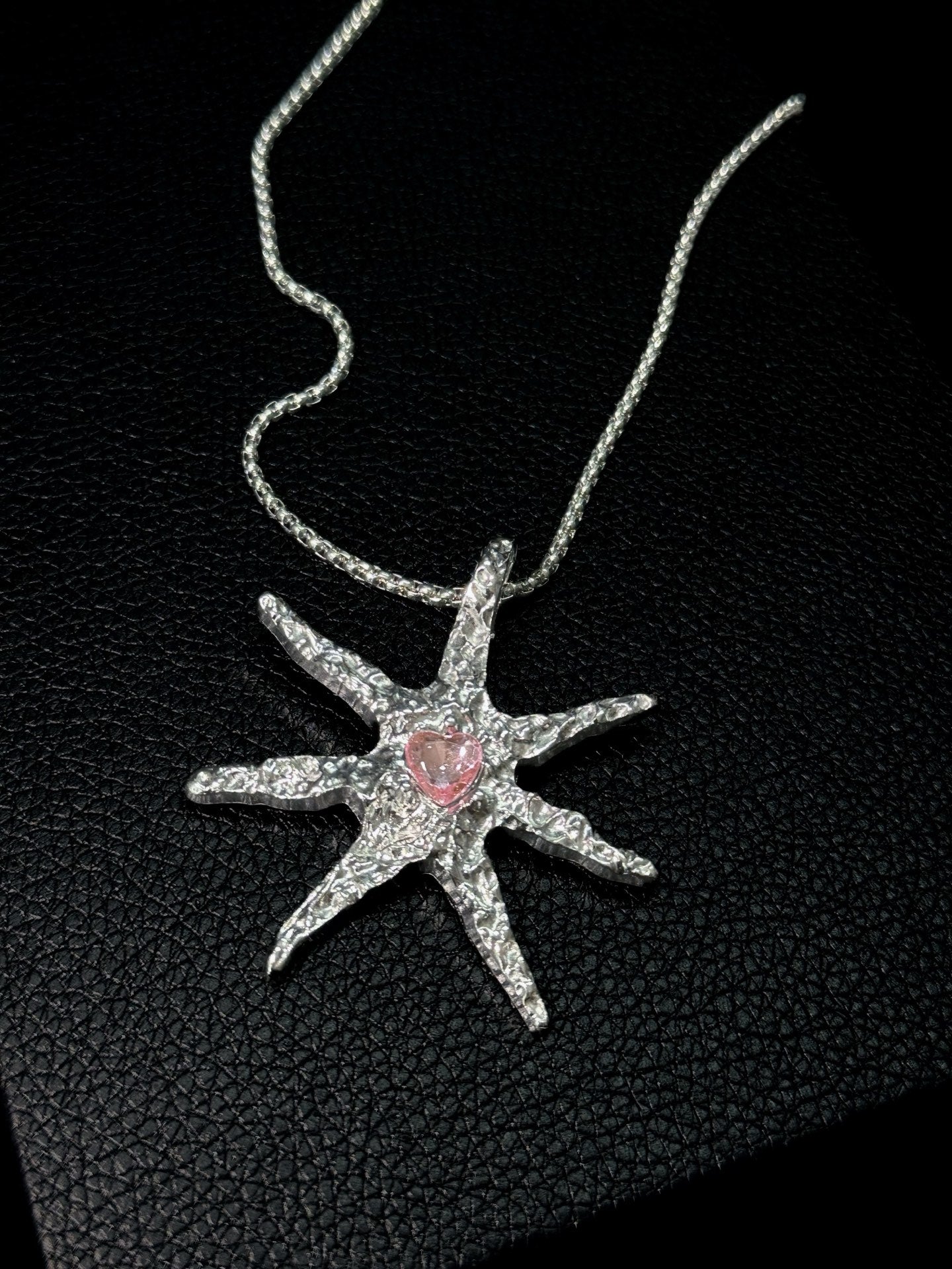 Spiked Starfish & Filigree Cross Heart Necklace Set in open Aslop Jewelry white gift box, angled view