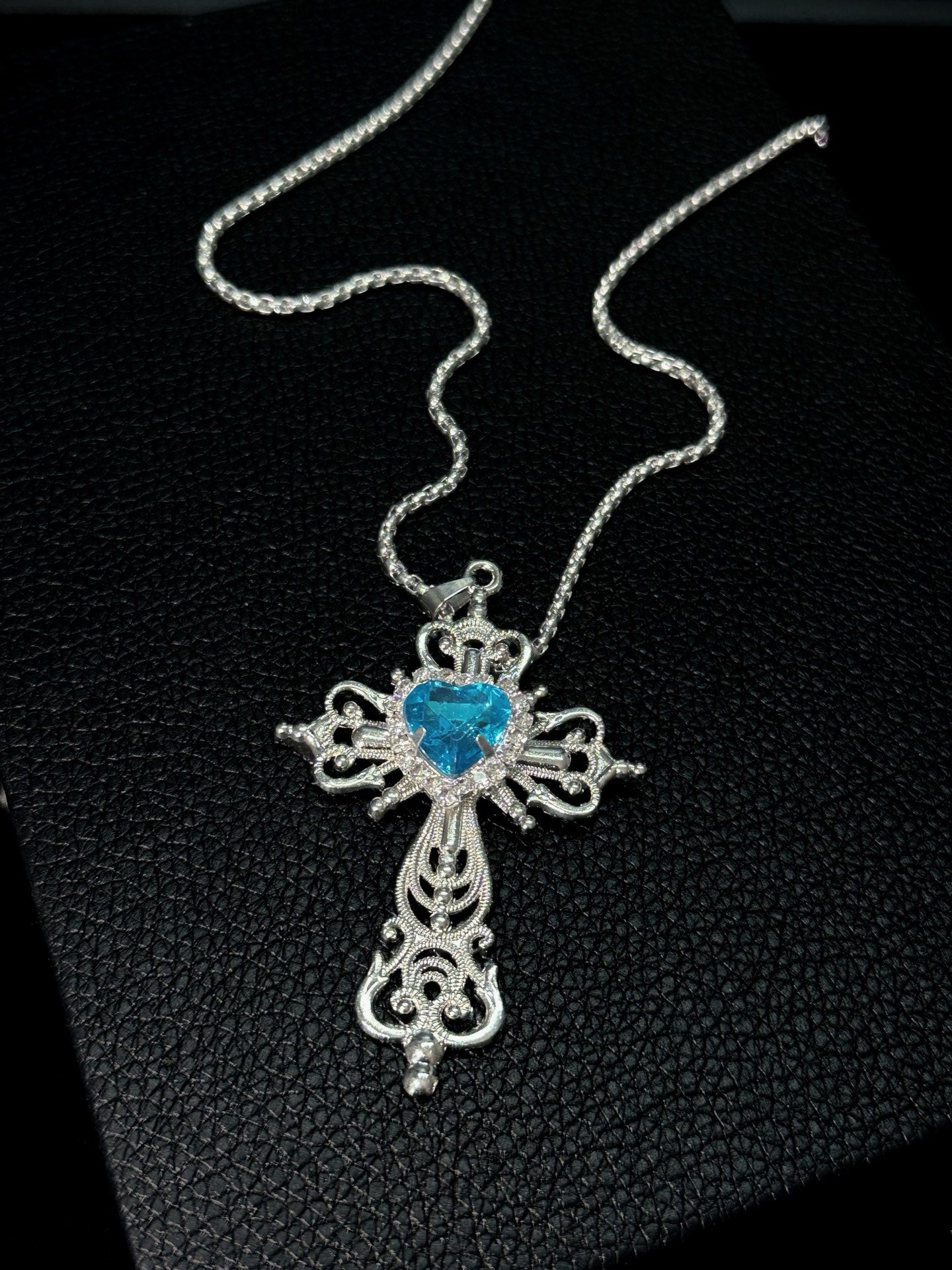 Spiked Starfish & Filigree Cross Heart Necklace Set in open Aslop Jewelry white gift box, overhead flat view